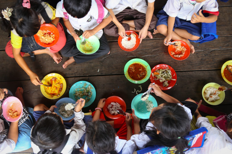 Children,Having,Lunch,In,Asian,School,Sitting,On,The,Floor