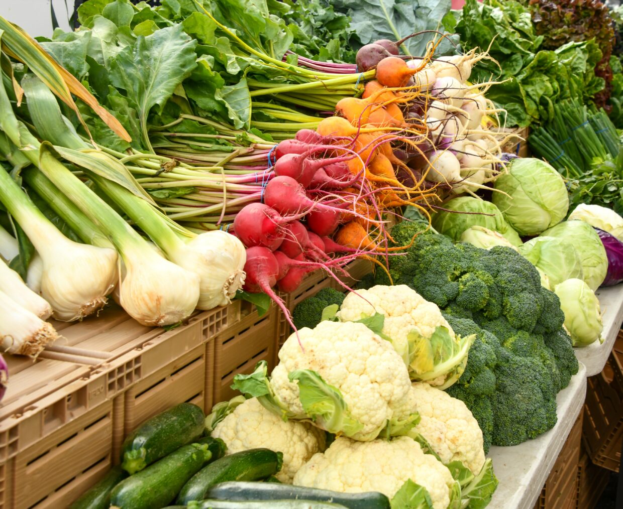 Vegetables like garlic, cauliflower, beets, and cabbage from a farm