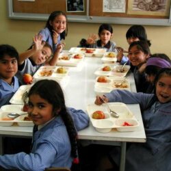 Chile school feeding program students who benefit from the program sit down for lunch.