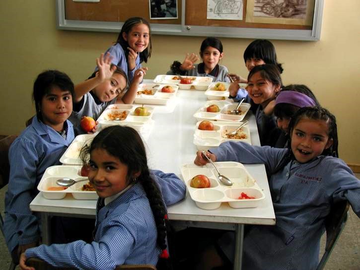 Chile school feeding program students who benefit from the program sit down for lunch.